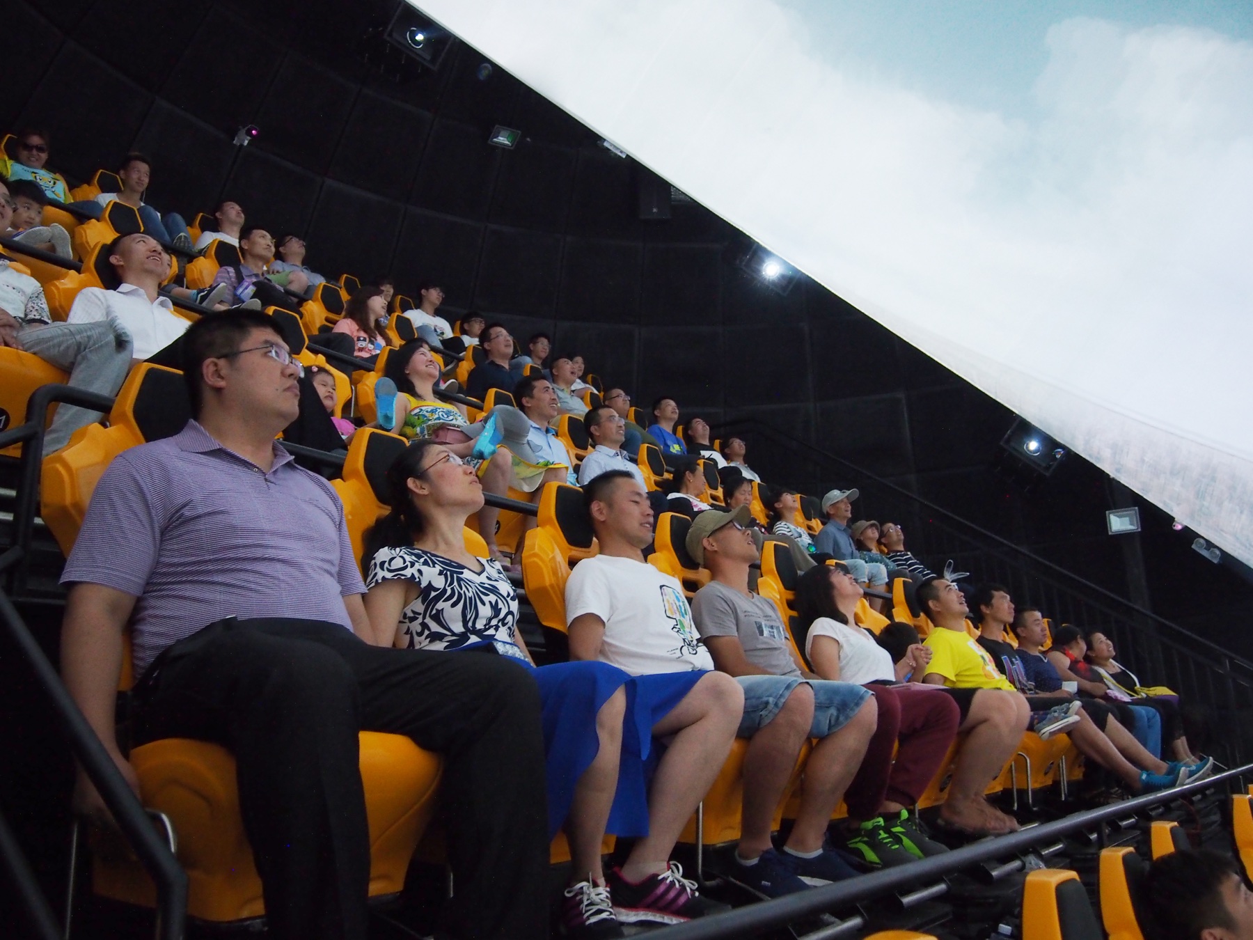 Visitors experiencing a 360 Dome Theater show on site