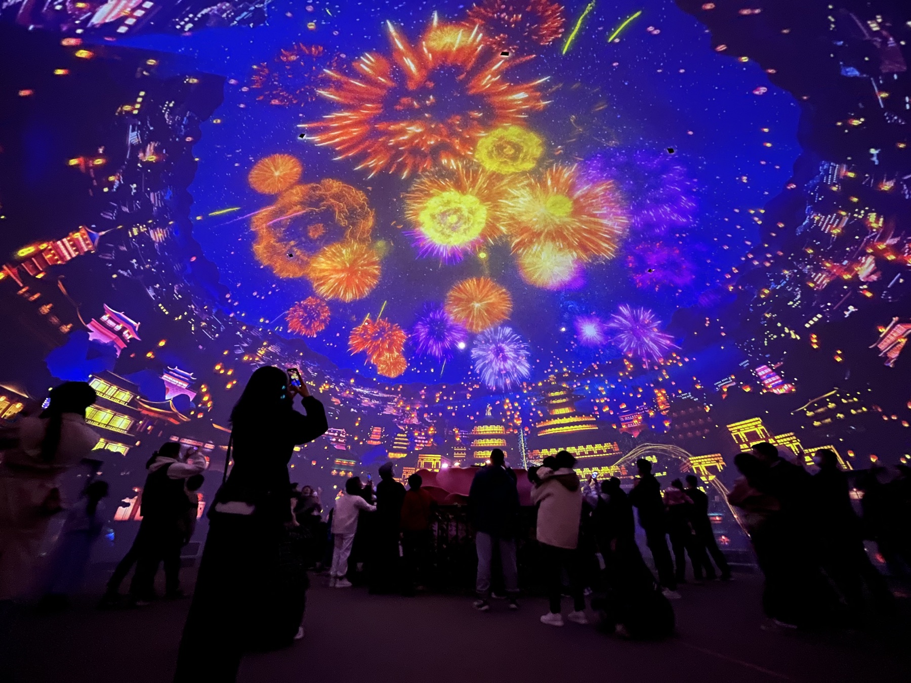Visitors experiencing the Dragon Gate immersive dome projection